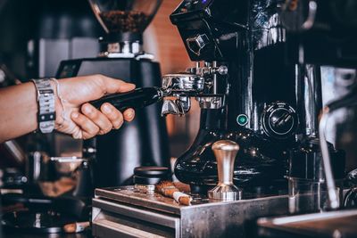 Cropped hand of man holding coffee