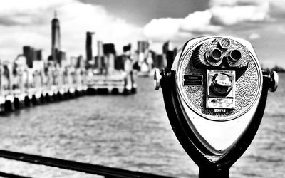 Close-up of coin-operated binoculars in city