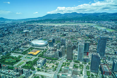 High angle view of city buildings against sky