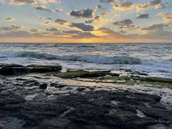 Scenic view of sea against sky during sunset