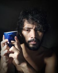Close-up portrait of man drinking water