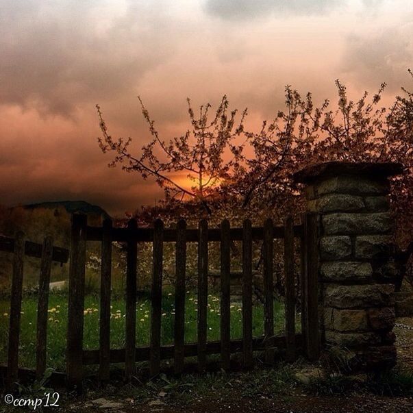 sky, cloud - sky, built structure, architecture, fence, cloudy, building exterior, cloud, old, protection, wood - material, sunset, safety, house, field, outdoors, nature, tranquility, security, abandoned