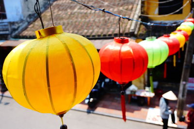 Close-up of yellow lanterns hanging