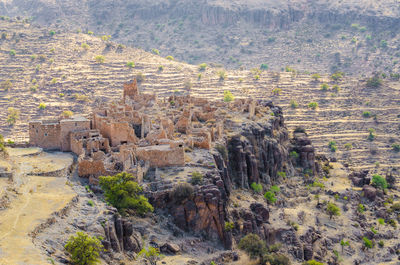 Aerial view of old ruin of moroccan kasbah in arid landscape of anti-atlas mountains, morocco