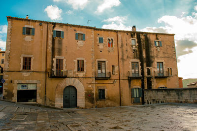 Low angle view of old building against sky