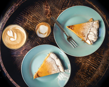 High angle view of coffee and cake on table