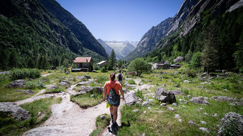 Rear view of man walking on mountain