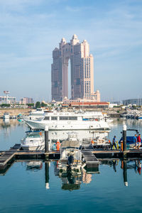 Boats moored at harbor