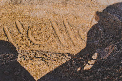 High angle view of shadow on sand