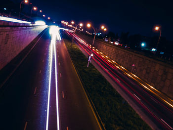 High angle view of light trails on road at night