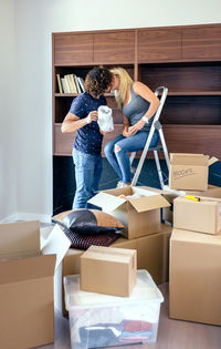 Full length of young couple at home