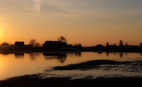 Scenic view of silhouette trees against sky during sunset