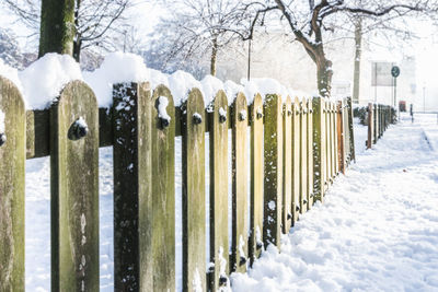 Panoramic view of snow covered cemetery