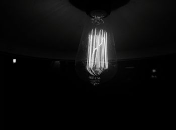Low angle view of lit lamp