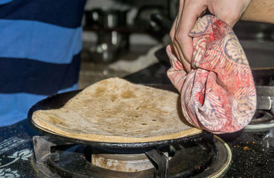 Close-up of person preparing food