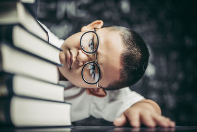 Portrait of man wearing eyeglasses on table