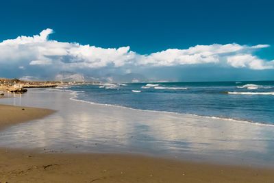 Scenic view of beach against sky