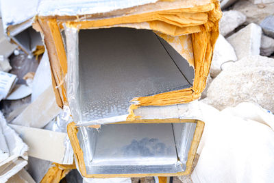 High angle view of broken metal structure during winter