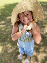 Portrait of a smiling girl holding toy