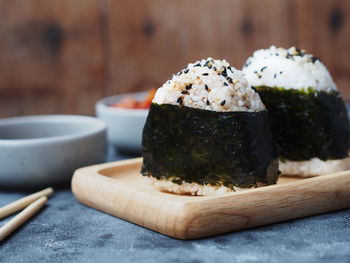 Close-up of japanese rice ball on cutting board