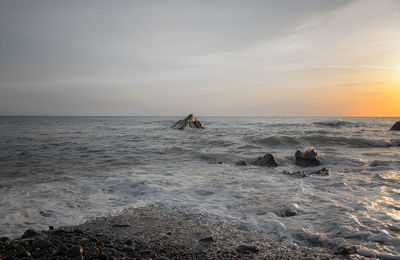 Scenic view of sea against sky during sunset