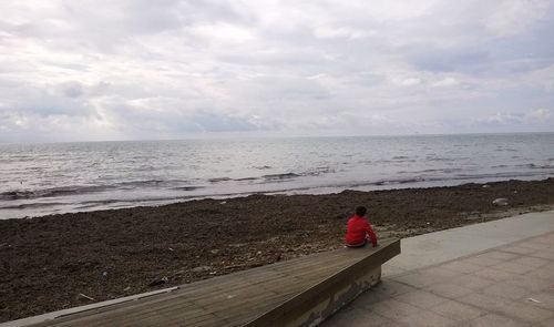 Scenic view of sea against cloudy sky