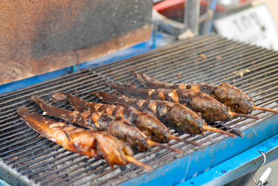 Close-up of meat on barbecue grill