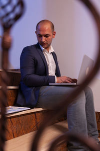 Portrait of businessman using mobile phone