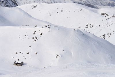 Aerial view of house on snow covered landscape