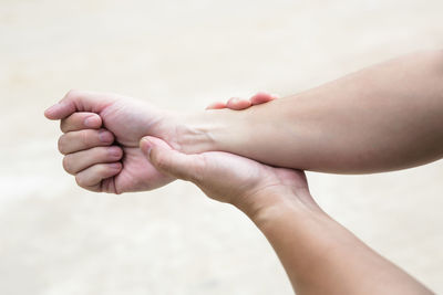 Close-up of hand holding hands