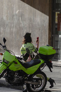 Rear view of woman riding motorcycle