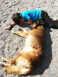 High angle view of man lying down on floor