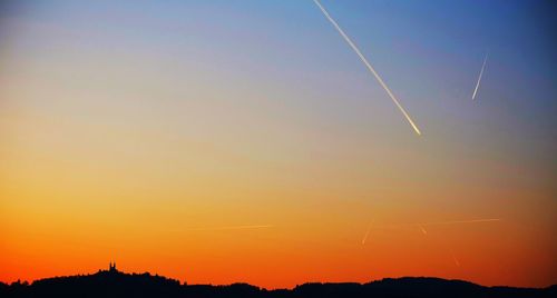 Silhouette of trees against sky during sunset