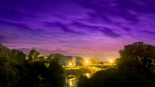 Scenic view of landscape against sky at night