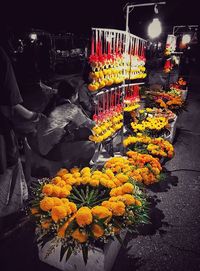 Yellow flowers for sale at market stall