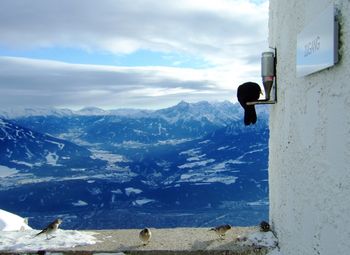 Scenic view of mountains against cloudy sky