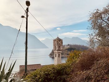 Panoramic view of building and mountains against sky