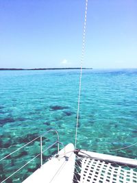 Scenic view of swimming pool by sea against clear sky