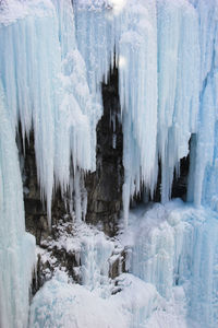 Panoramic view of frozen waterfall