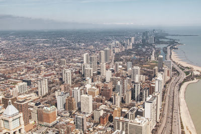 High angle view of modern buildings in city against sky