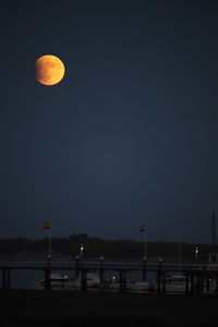 Scenic view of sea against sky at night