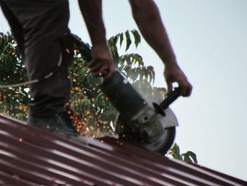 Low section of man working on water