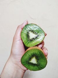 Cropped image of person holding fruit