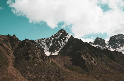 Panoramic view of rocky mountains against sky