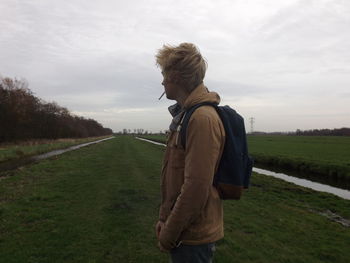 Man standing on grassy field