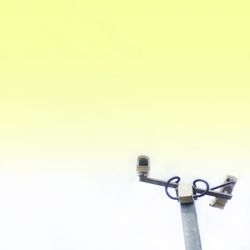 Close-up of lamp post against clear sky