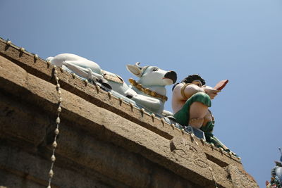 Low angle view of sculpture against clear sky