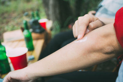 Midsection of man holding drink