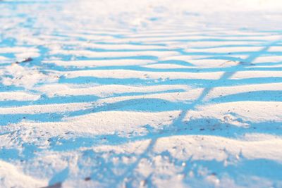 High angle view of shadow on snow covered field