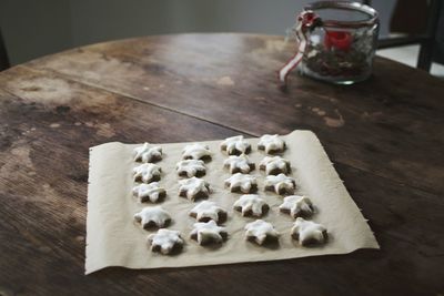 High angle view of star shaped cookies on paper at home